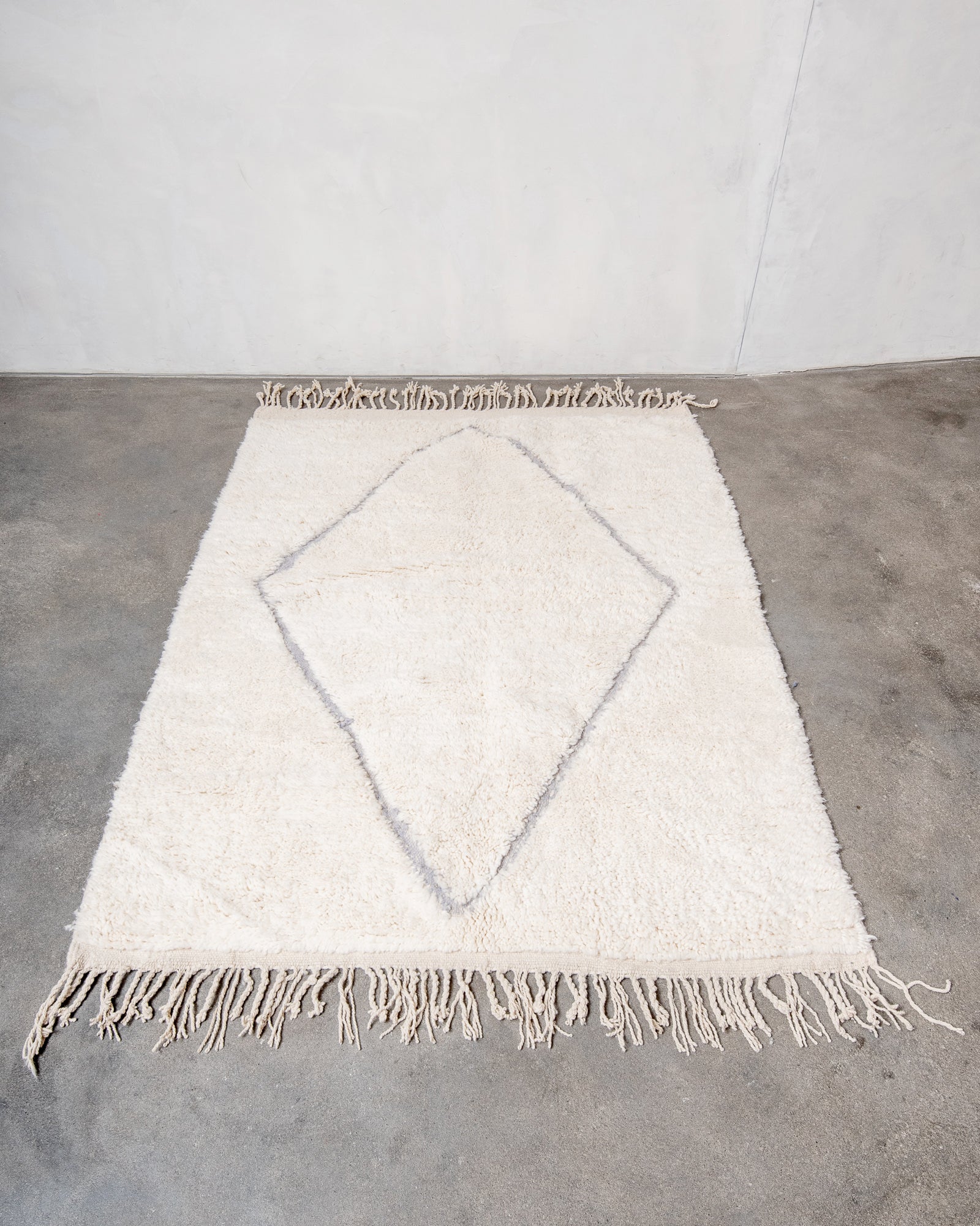 Modern, designer, handcrafted Berber rug from Morocco. Beniourain carpet with beautiful colours and patterns and fluffy wool texture.